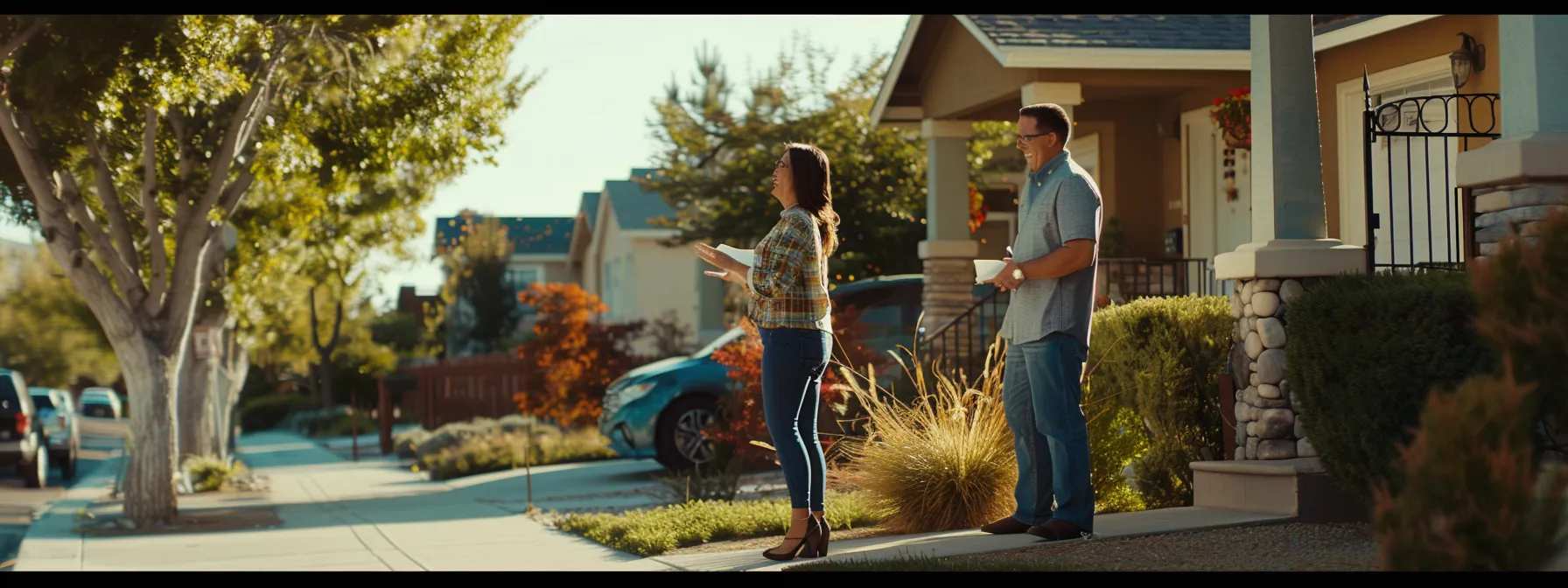 a couple happily negotiating the best deal with a real estate agent in a charming st. george neighborhood.