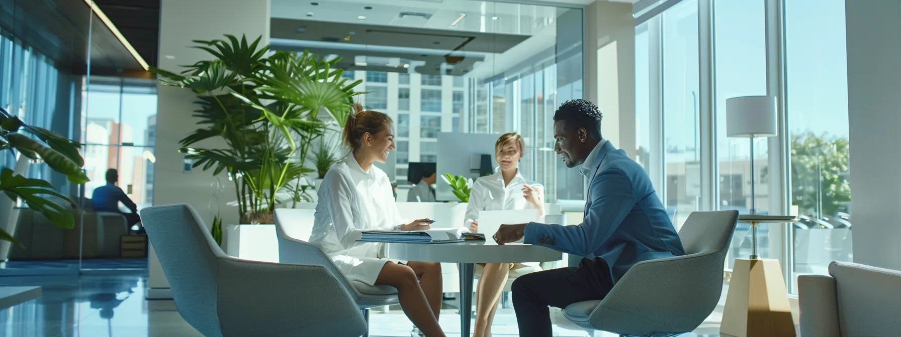 a couple reviewing financial documents with a loan officer in a bright, modern office space.