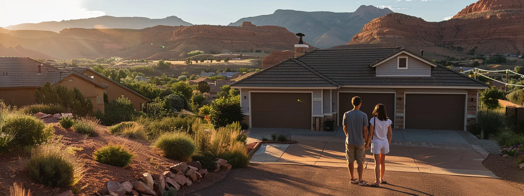 a couple stands in front of a picturesque st. george home, discussing their property requirements with a real estate agent.