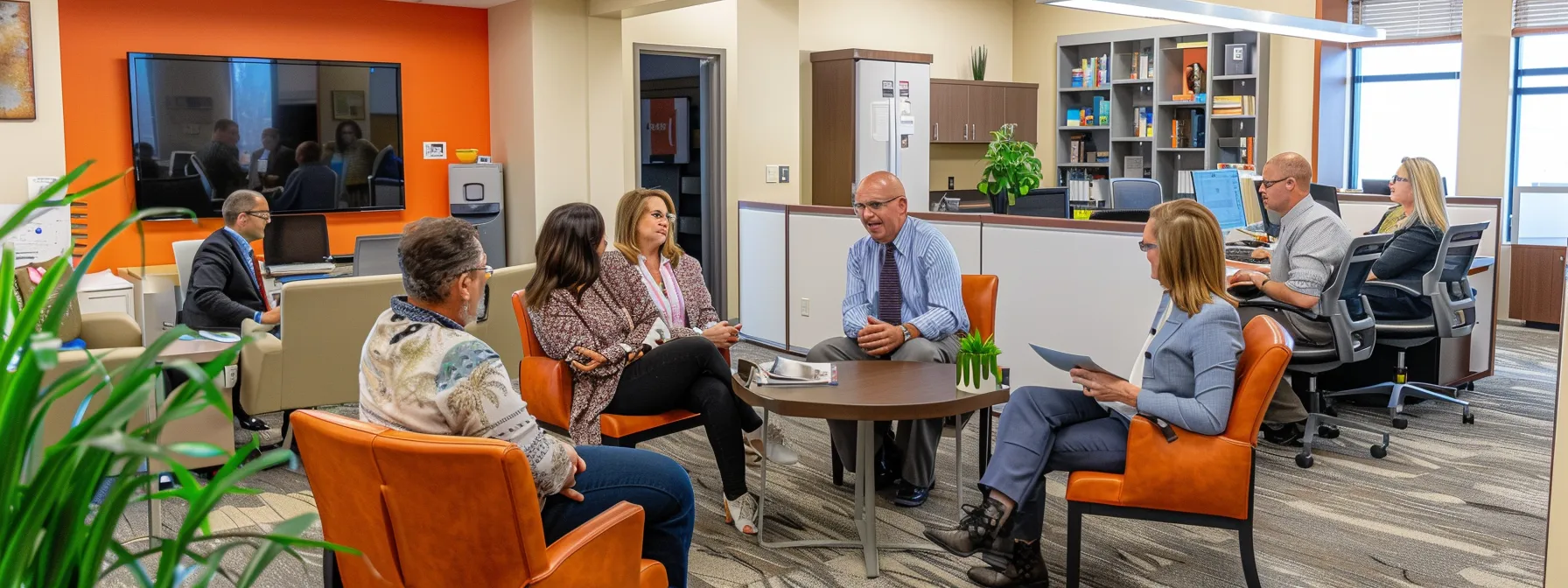 a diverse group of lenders discussing mortgage options in a vibrant office setting in st. george.