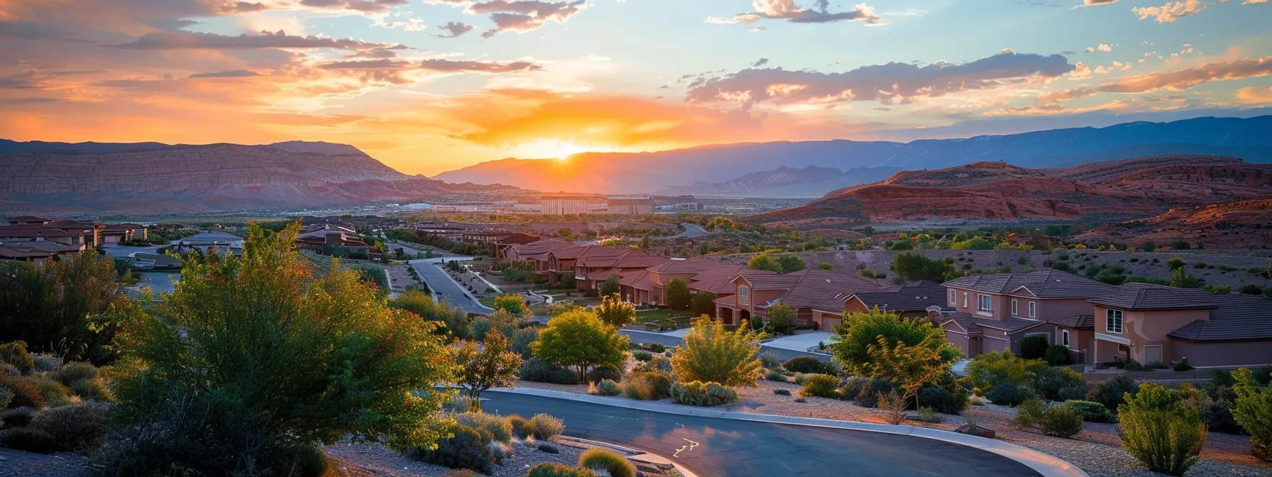 a picturesque sunset over the red rock landscape of st. george, highlighting the peaceful and thriving community in the area.