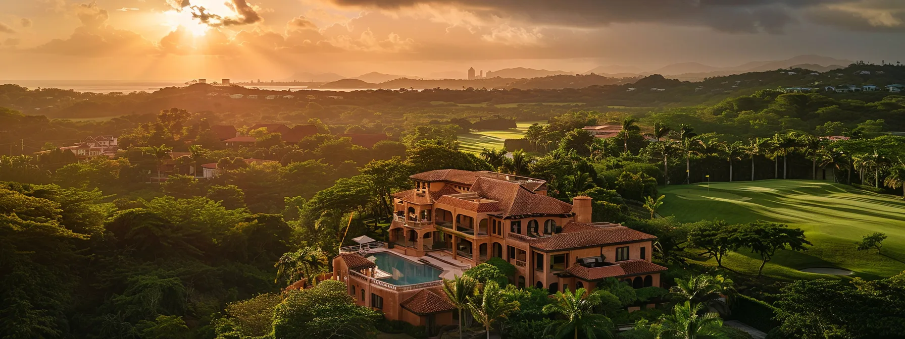 a stunning view of a coral-hued villa overlooking a lush golf course in one of st. george's premier luxury communities.