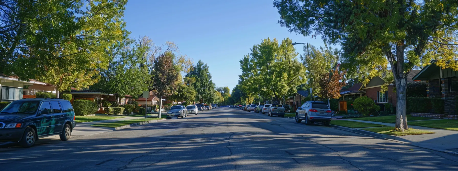 a vibrant neighborhood street filled with a variety of homes, from charming traditional houses to modern mobile homes, reflecting the diversity of opportunities in the st. george real estate market.