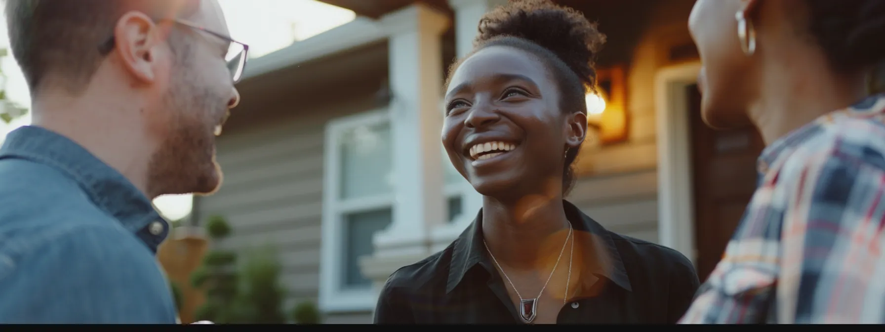 a young couple smiling as they receive the keys to their first home, surrounded by a team of supportive professionals offering financial assistance and guidance.